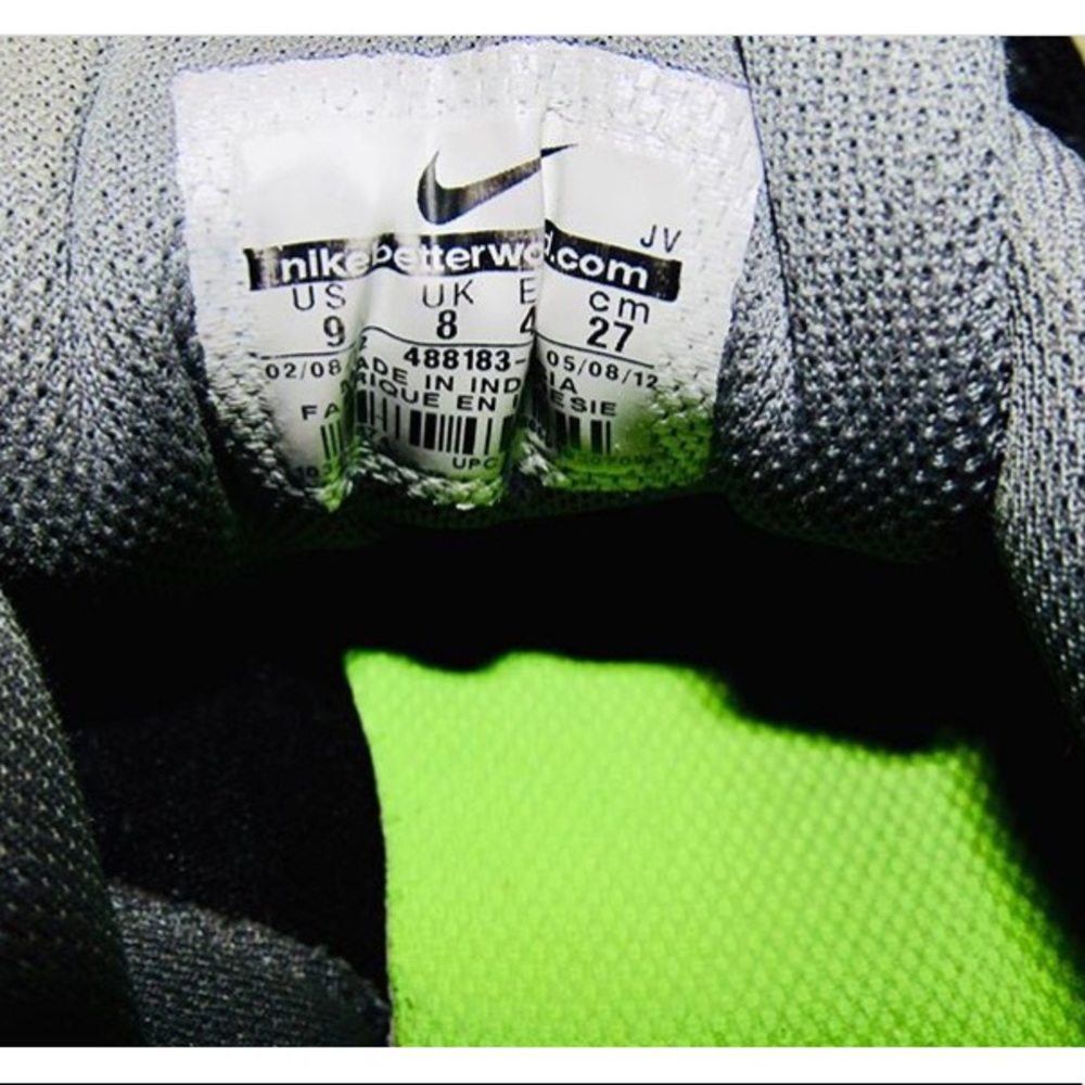 Neon green and black Nike tennis shoes